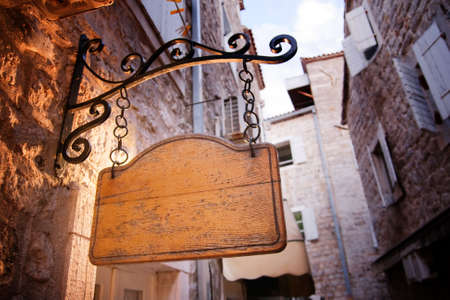 Blank rustic entrance wooden board hanged upの写真素材