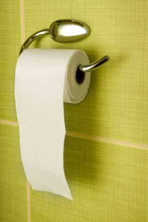 Rolled toilet paper hanging in the bathroomの写真素材