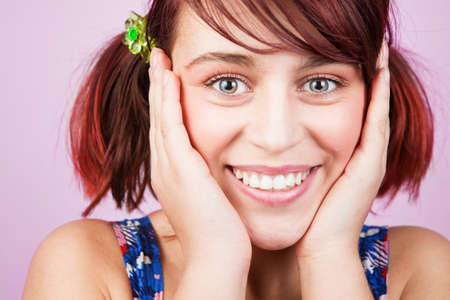 Colorful portrait of happy cheerful teen womanの写真素材