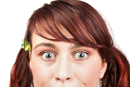 Amazed eyes of teen young girl over whiteの写真素材