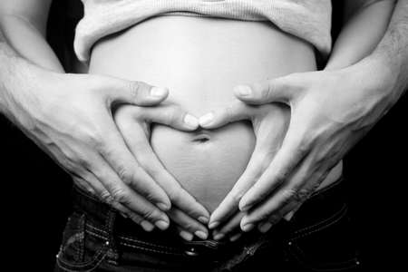 Love and pregnancy concept - pregnant woman and husbandの写真素材