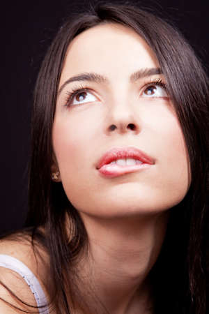 Woman with sexy lips expressing desire over blackの写真素材