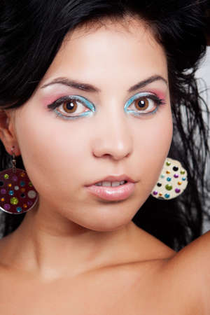 Cute brunette woman with nice colorful make-upの写真素材