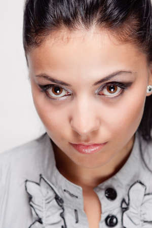Close up studio portrait of young hispanic womanの写真素材