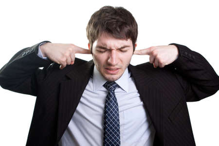 Isolated businessman expressing stress and noise conceptの写真素材