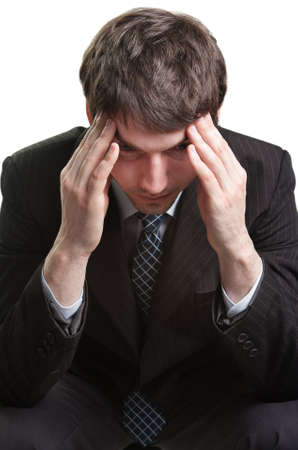 Tired and stressed businessman overwhelmed by problemsの写真素材