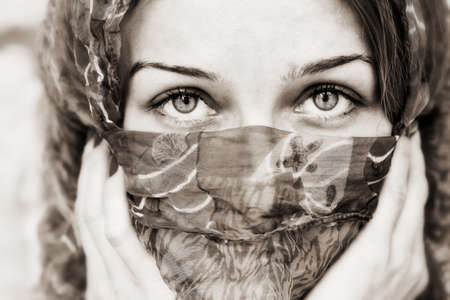 Sensual eyes of young woman behind vailの写真素材