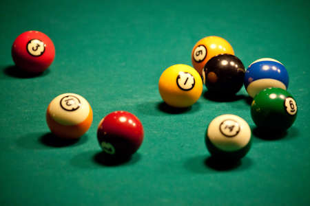 Pool balls on green billiard tableの写真素材