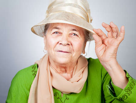 Happy joyful old senior lady in elegant nice clothesの写真素材