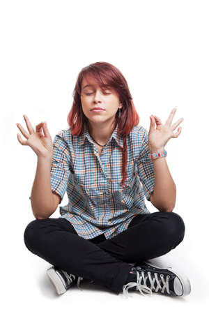 Young student woman in yoga position over whiteの写真素材
