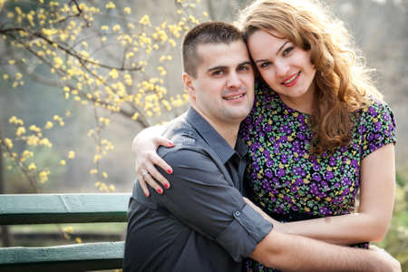 Happy couple - portrait of cute lovers in park の写真素材