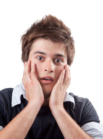 Amazed scared young man isolated on white backgroundの写真素材