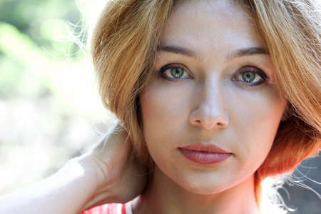 Face of sensual beautiful woman posing outdoorsの写真素材