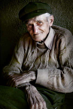 Content senior old man with expressive eyesの写真素材