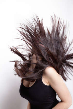 Active woman with long hair in motionの写真素材