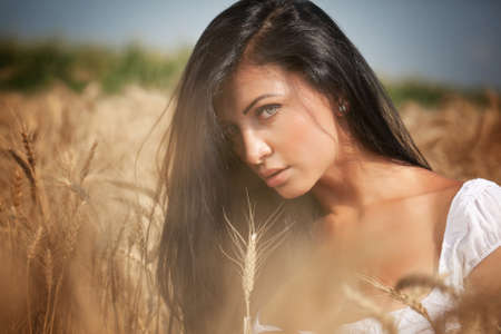 Sensual beautiful woman in rural grain fieldの写真素材