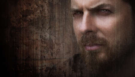 Artistic grungy portrait of cool man with nice eyesの写真素材