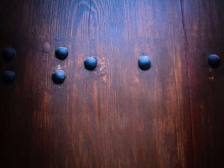 Abstract wooden background with metallic decorationsの写真素材