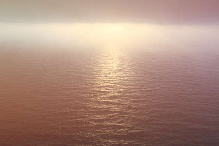 Ocean water and foggy sky at sunset in Atlanticの写真素材