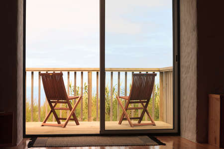Two chairs on holiday villa terraceの写真素材