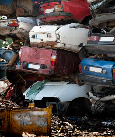 Car cemetery - pile of old rusty damaged carsのeditorial素材