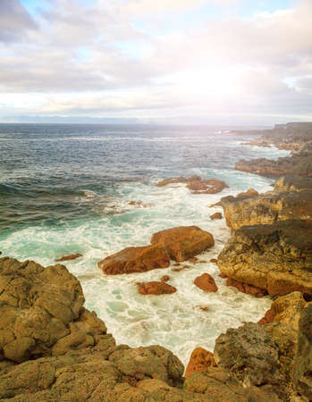 Rocks, sea waves and sunny sky in Azoresの写真素材