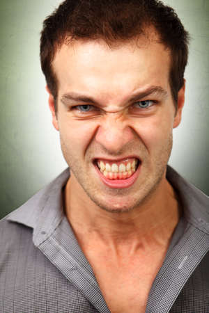 Face of angry furious young manの写真素材