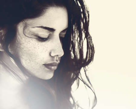 Artistic portrait of beautiful sensual young womanの写真素材
