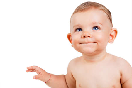 One baby boy child isolated on white and looking upの写真素材