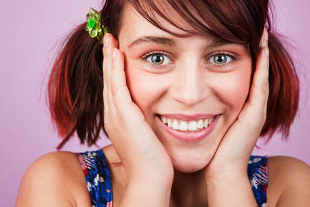 Colorful portrait of happy cheerful teen womanの写真素材