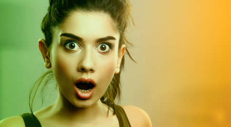Face expression of shocked surprised young cute womanの写真素材