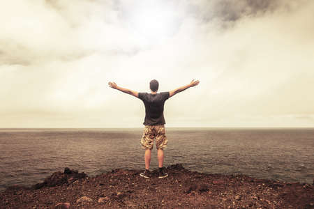 Success and freedom concept â grateful free person in front of bright skyの写真素材