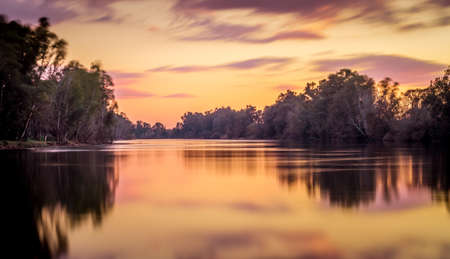 Long exposure with sunset colors on the natural border of the Guadiana riverの写真素材