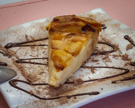 cheesecake with apple and chocolate syrup