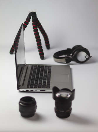 organization of photographic material and editing with computer on work table