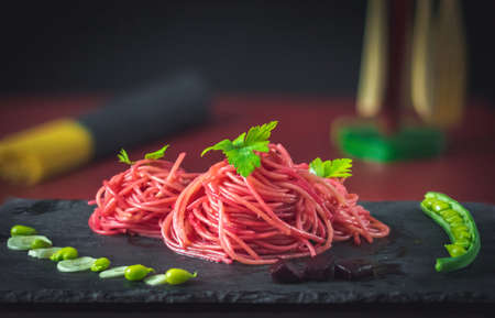 spaghetti with beetroot and green beansの写真素材