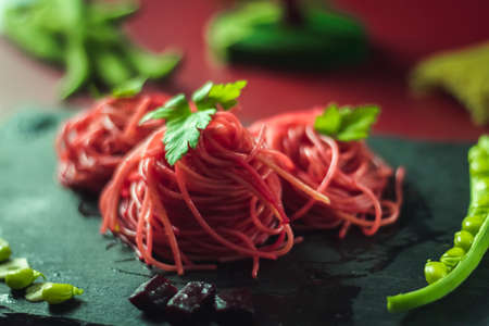 spaghetti with beetroot and green beansの写真素材