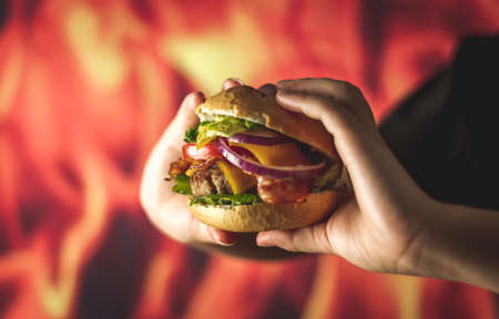 extra burger of cheese, bacon, onion and chipsの写真素材