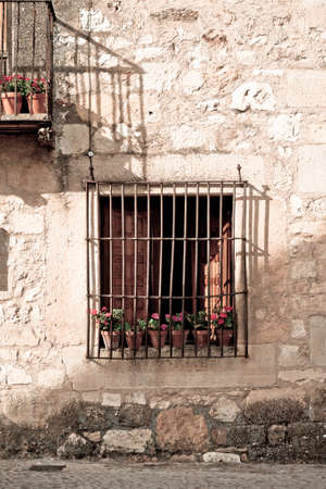 An old flowery window in Pedraza, Segovia (Spain)の写真素材