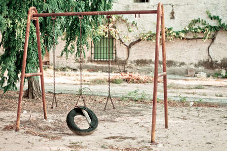 An old and lonely swingの写真素材