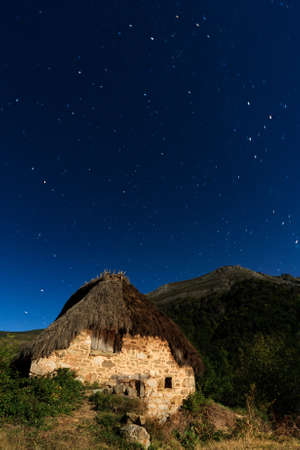 Night shot of a cottage on the mountain, Picos de Europa (Spain)の写真素材