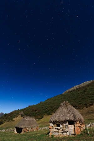 Night shot of a cottage on the mountain, Picos de Europa (Spain)の写真素材