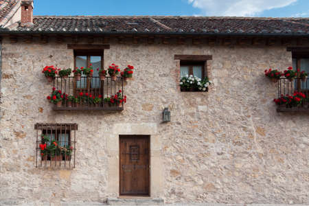 An old flowery house in Pedraza, Segovia  Spain の写真素材