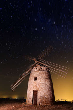 A typical windmill surrounded of stars in Castilla la Mancha, Spainの写真素材