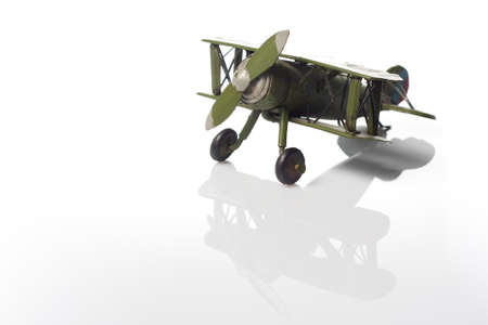 A green model of an old airplane