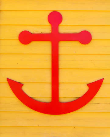 Close-up of a boat anchor with yellow backgroundの写真素材