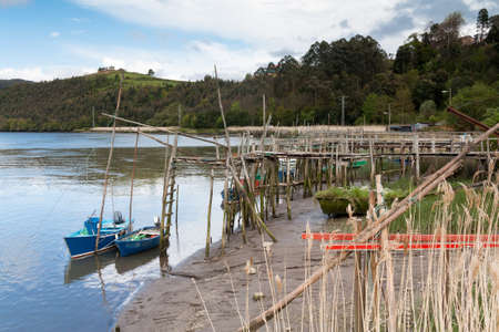 Some fishing boats at the end of their piersの写真素材