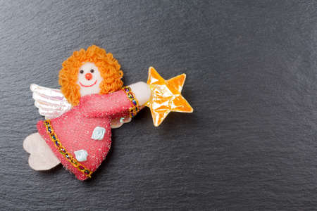 Christmas ornament  Annunciation Angel Gabriel with a slate stone as backgroundの写真素材