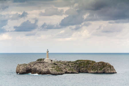 A lighthouse in the Mouro Island, Santander  Spain の写真素材