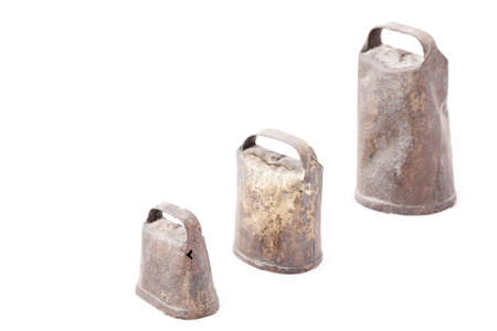 Old and rusty cowbells isolated on white backgroundの写真素材